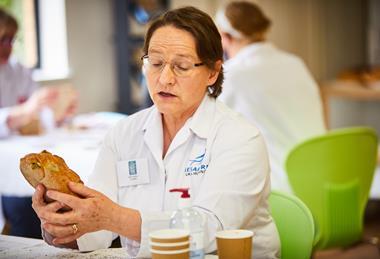 Sara Autton judging a loaf at the Britain's Best Loaf competition