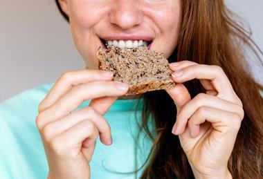 Person-Eating-Wholemeal-Bread-With-Seeds-01 RS 2