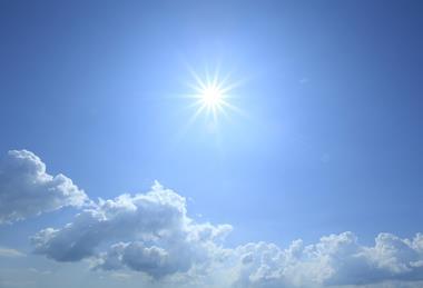 Sun high in a blue sky
