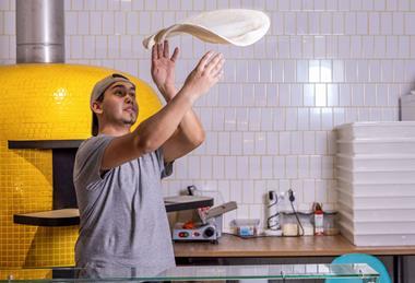 Image-1--Pizza-chef-handling-a-pizza-base cropped