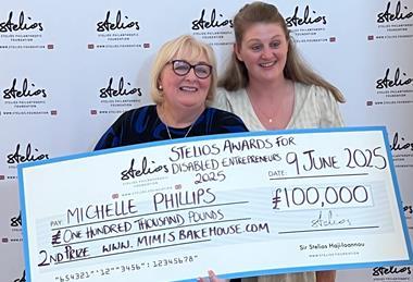 Michelle and daughter Ashley collecting the cheque