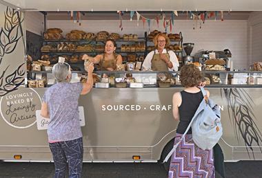 Lovingly Artisan's Catherine Connor (back right) and Emily Tagg serve customers from its new Bread Truck   2100x1400