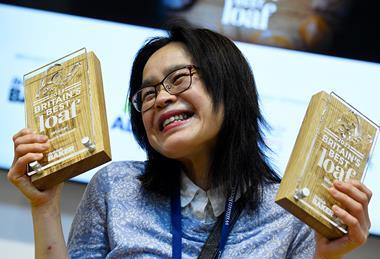 Kuma-San Bakehouse founder Miyo Aoetsu gleefully grips her trophies for Britain’s Best Loaf 2023 and Innovation category winner