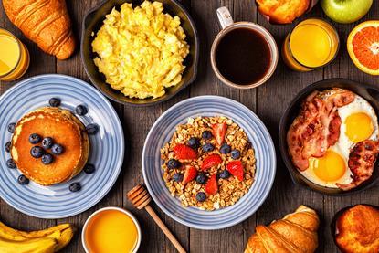 A selection of breakfast options including pancakes, granola, and eggs