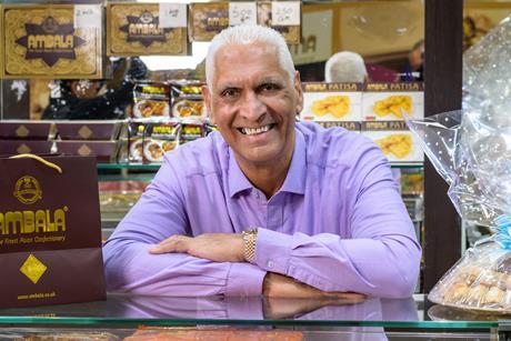 Cake Box - CEO Sukh Chamdal stands behind the counter of an Ambala Foods shop - 1586x1800