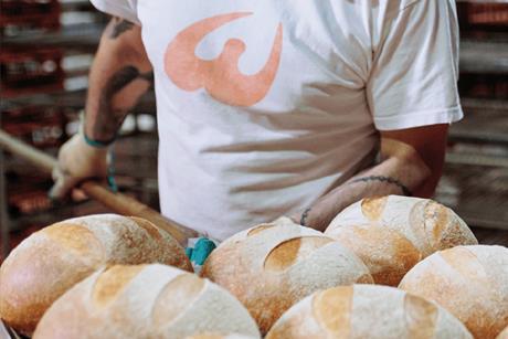 Wenzel's The Bakers - A worker bakes loaves at Wenzel's main bakery in Northwood near Watford