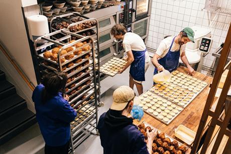 Farro bakers in action filling tarts and cruffins