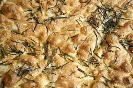 A close-up of a sea salt and rosemary focaccia