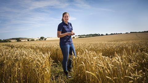 Emily Munsey in a field of wheat
