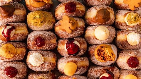 Close up of Bread Ahead doughnuts with a variety of toppings