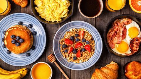 A selection of breakfast options including pancakes, granola, and eggs