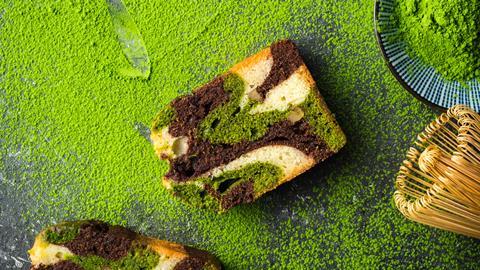 A matcha and chocolate cake with matcha tea