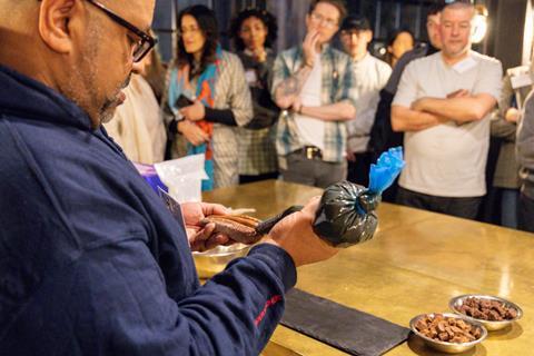 Graham Hornigold filling a long doughnut with chocolate cremeux
