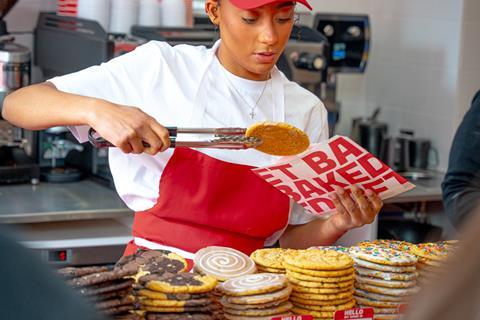 Get Baked - A worker serves a cookie at the new shop in Manchester's Northern Quarter - 2100x1400