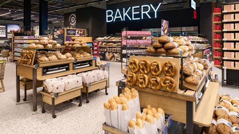 A freshly stocked M&S bakery with pretzels, sourdough rolls, and more