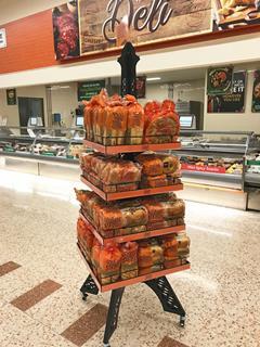 An Eiffel Tower display rack stocked with St Pierre brioche products at Morrisons store.
