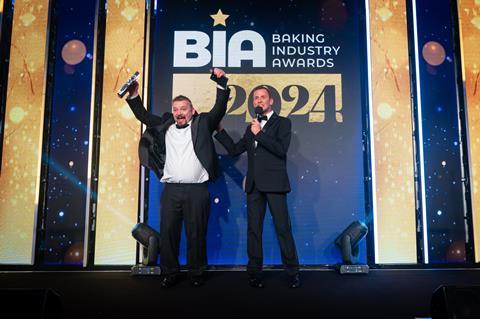 Sandor Bagameri of Stir Bakery celebrates onstage after winning Speciality Bread of the Year 2024