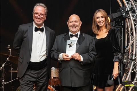 Mark Bennett (centre) grins while clutching the Speciality Bread Product of the Year Award next to Bako CEO Mike Tully and Alex Jones