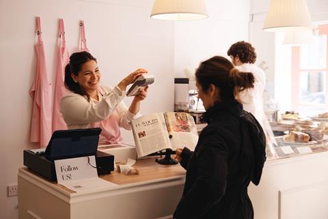 Sara Sallow - Abba Cakes founder Laura Alejandro serves a customer at the new shop in Chester - 2100x1400