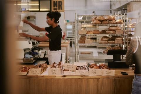 Northern Rye bakery counter with person making coffee