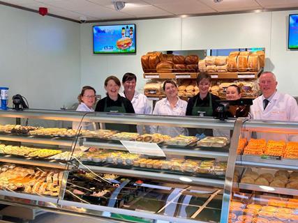 Staff behind the counter of Greenhalgh's new bakery shop in Burscough.