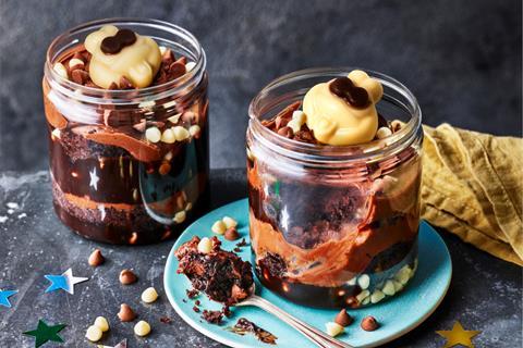 Colin the Caterpillar cake jars with layers of chocolate cake, frosting, and decorations