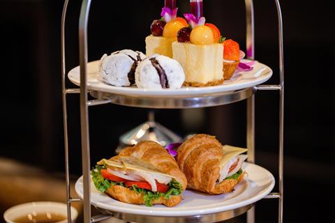 Cakes and filled croissants on a cake stand