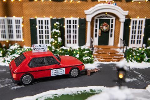 The pizza delivery van Little Nero's knocks over the statue in the front garden. A Christmas wreath is on the door in the background