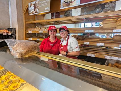 Sara Littlewood and Amanda Brown ready to welcome customers to the Stacey's bakery shop  2000x1502