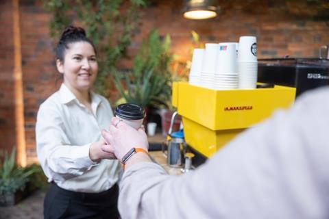 A woman serving coffee