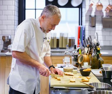 Bridor - Chef Michel Roux Jr cuts strips of croissant during a live cooking demonstration at The Langham hotel in London - 2100x1400