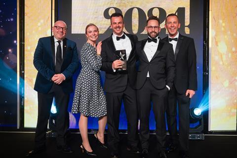 The Pettigrew Bakeries team – Jemma Medlicott, David Le Masurier and Lee Le Masurier – smile proudly after being presented the Craft Bakery Business of the Year award by Dawn Foods’ sales director Garry Russell and celebrity host Scott Mills