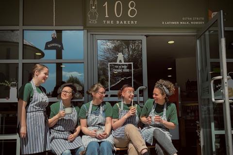 Staff in stripey blue aprons outside 108 The Bakery