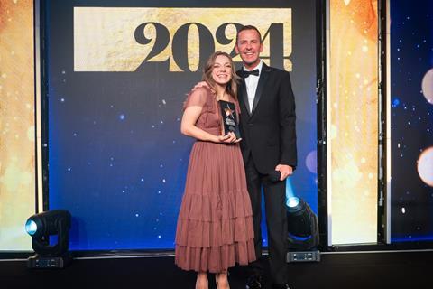 Celebrity host Scott Mills presents 2024 Rising Star Award winner Naomi Spaven with her trophy