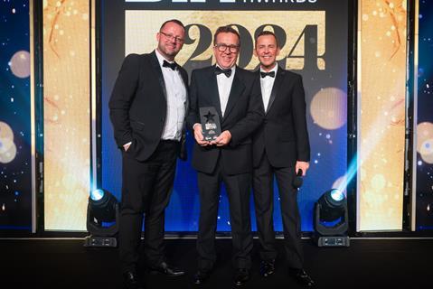 Mike Moran, sales director of longstanding category sponsor Brook Food & Bakery Equipment, and Scott Mills presents Aidan Monks from Lovingly Artisan with his second Baker of the Year trophy