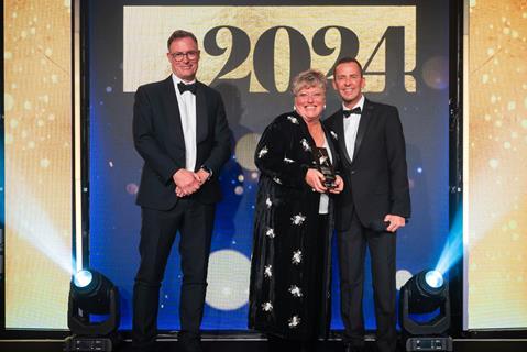 Elaine Hamey beams with pride after being named Celebration Cake Maker of the Year 2024. She was presented her trophy by Finsbury Food Group’s business development director Simon Staddon and host Scott Mills