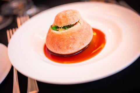 A bread roll filled with cheese and onion chutney