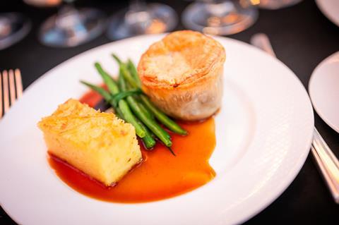 A close up of a pie and buttery potatoes