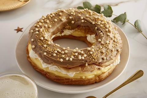 A round choux pastry filled with cream and custard and a coffee icing on top