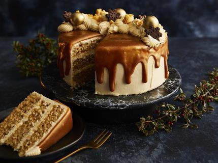 A caramel drip cake with lashing of buttercream on top