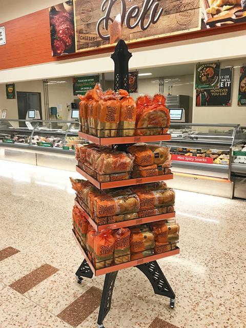 An Eiffel Tower display rack stocked with St Pierre brioche products at Morrisons store.