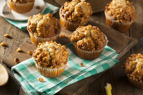 Banana nut muffins on a wooden board