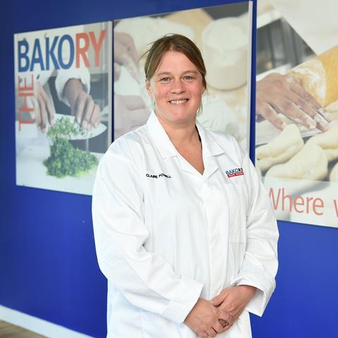 Claire Powell, a technical baker at Bako, in a white baker's jacket