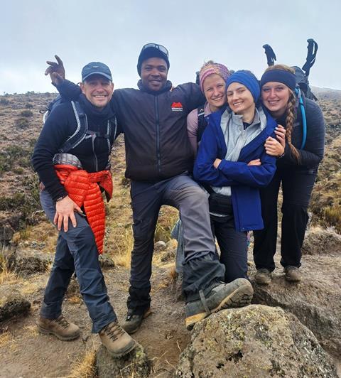 L-R Bako employees Ian Best, Marta Skomoroko, Joanna Walaszczyk, and Lucy John pose with their local guide (second left) on Day 4 of their trek to the summit of Kilimanjaro - Bako Group (1)