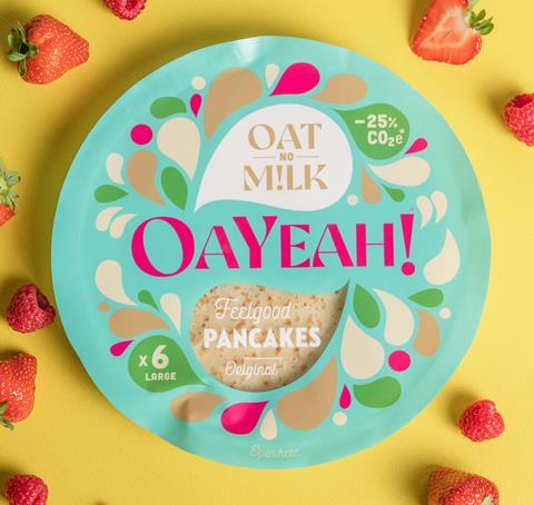 OaYeah Pancakes in blue packaging on a yellow background with strawberries