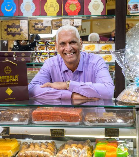Cake Box - CEO Sukh Chamdal stands behind the counter of an Ambala Foods shop - 1586x1800