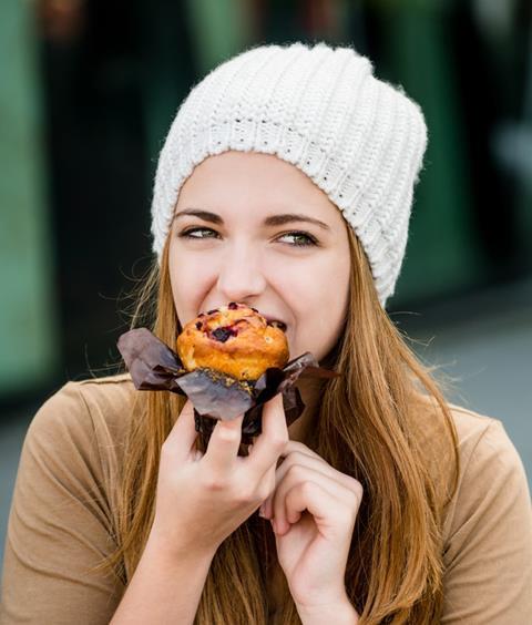 Woman eating a muffin