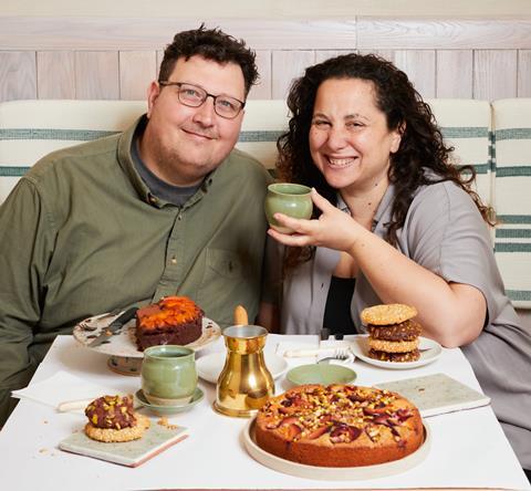 Honey & Co. co-founders Sarit Packer and Itamar Srulovich display a selection of their Middle Eastern bakery offerings.