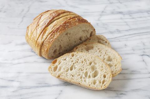 Sourdough loaf on marble background