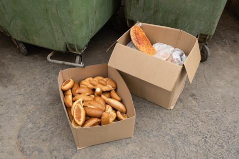 Discarded bread by bins